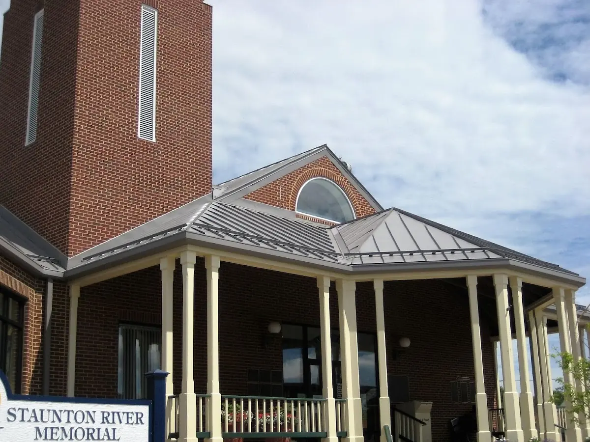Skilled roofing craftsmen working on a residential roof in Floydville